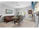 Bright living room features neutral decor, casual seating, and a mounted television at 2102 Congress Ln, St Cloud, FL 34769
