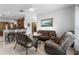 Comfortable living area connecting to the kitchen, with casual seating and neutral decor at 2102 Congress Ln, St Cloud, FL 34769
