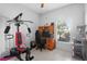 Bright office space featuring a home gym, desk, shelving, and a large window at 2102 Congress Ln, St Cloud, FL 34769