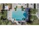 Aerial view of community pool with ample seating and pergola covered picnic area at 2102 Congress Ln, St Cloud, FL 34769