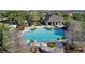 Aerial view of community pool and clubhouse with playground and plenty of seating at 2102 Congress Ln, St Cloud, FL 34769