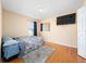 Cozy bedroom with wood floors, natural light and neutral decor at 2150 Flintlock Blvd, Kissimmee, FL 34743
