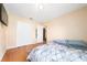 Comfortable bedroom with wood floors, closet and neutral decor at 2150 Flintlock Blvd, Kissimmee, FL 34743