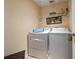 Convenient laundry room with washer and dryer, providing functionality at 2150 Flintlock Blvd, Kissimmee, FL 34743