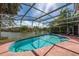 A beautiful screened in pool with lovely views of the lake at 2150 Flintlock Blvd, Kissimmee, FL 34743