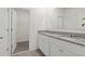 Bathroom featuring a double sink vanity with a granite countertop, and a walk-in closet at 2188 Tay Wes Dr, St Cloud, FL 34771
