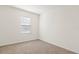 This bedroom offers neutral carpet, white walls, one window, and a minimalist design at 2188 Tay Wes Dr, St Cloud, FL 34771