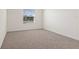 Bright bedroom with soft carpeting and a window at 2188 Tay Wes Dr, St Cloud, FL 34771
