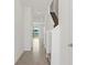 Bright hallway with tile flooring and stairs leading to the upper level at 2188 Tay Wes Dr, St Cloud, FL 34771