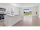 Bright kitchen with granite countertops and eat in space with sliding glass doors at 2188 Tay Wes Dr, St Cloud, FL 34771
