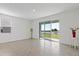 Open living space with large sliding glass doors and tile flooring at 2188 Tay Wes Dr, St Cloud, FL 34771