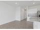 Open concept living space featuring tile flooring, granite counters and white cabinets at 2188 Tay Wes Dr, St Cloud, FL 34771