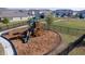 A fenced playground with a slide, climbing structure, and wood chip ground covering at 2188 Tay Wes Dr, St Cloud, FL 34771