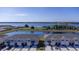 The townhome has a tranquil view of a pond with ample parking and easy access to community amenities at 2188 Tay Wes Dr, St Cloud, FL 34771