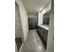 Bathroom with granite countertops, double sinks, and a shower with gray curtain at 2755 Gentle Rain Dr, Davenport, FL 33837