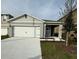 Charming single-Gathering home with a two-car garage and well-maintained landscaping at 2755 Gentle Rain Dr, Davenport, FL 33837