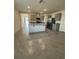 Open concept kitchen with stainless steel appliances, gray cabinets, and tile floors at 2755 Gentle Rain Dr, Davenport, FL 33837