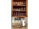 Cabinet interior holding glassware above the bar station at 2917 Kokomo Loop, Haines City, FL 33844