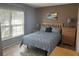 This bedroom features natural light, neutral walls and a queen size bed at 2917 Kokomo Loop, Haines City, FL 33844