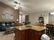 Open layout with kitchen island, dining, and comfortable seating area at 2917 Kokomo Loop, Haines City, FL 33844