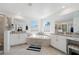 Bright bathroom featuring dual vanities, a soaking tub, and a walk-in shower at 3010 Camden Way, Davenport, FL 33837