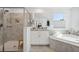 Bathroom with a walk-in shower, soaking tub, and neutral tile at 3010 Camden Way, Davenport, FL 33837