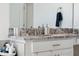 Bathroom vanity featuring granite countertops, white cabinetry and modern fixtures at 3010 Camden Way, Davenport, FL 33837