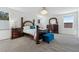 Primary bedroom with dark wood furniture, plush carpet, and a stylish light fixture at 3010 Camden Way, Davenport, FL 33837