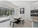 Bright breakfast nook featuring a modern chandelier, white marble table, and sliders to the pool at 3010 Camden Way, Davenport, FL 33837