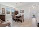 Inviting dining room featuring a modern chandelier and neutral color palette at 3010 Camden Way, Davenport, FL 33837