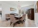 Dining area with a spacious table, buffet, hutch, neutral decor, and bright natural light at 3010 Camden Way, Davenport, FL 33837