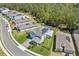 Beautifully landscaped home with solar panels on the roof and a well-maintained lawn at 3010 Camden Way, Davenport, FL 33837