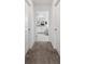 Hallway view into bathroom with a bathtub at 3010 Camden Way, Davenport, FL 33837