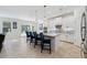 Well-lit kitchen featuring a spacious island with barstool seating and modern cabinetry at 3010 Camden Way, Davenport, FL 33837