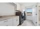 A well-equipped laundry room with modern appliances and ample storage space at 3010 Camden Way, Davenport, FL 33837