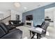 Comfortable living room with a modern fireplace and stylish blue accent wall at 3010 Camden Way, Davenport, FL 33837