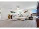 Spacious living room with large sectional couch and decorative wall art at 3010 Camden Way, Davenport, FL 33837