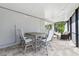 Outdoor patio area with a table and chairs, perfect for entertaining at 3010 Camden Way, Davenport, FL 33837