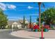 Beautifully landscaped clubhouse with well-manicured grounds and vibrant potted plants at the entrance at 4002 San Gallo Dr # 106, Kissimmee, FL 34741