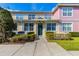 Charming townhome with colorful exterior, well-manicured landscaping, and inviting entryway at 4002 San Gallo Dr # 106, Kissimmee, FL 34741