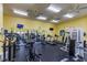 Spacious fitness center featuring modern exercise equipment, mirrored walls, ceiling fans, and a clean, well-maintained environment at 4002 San Gallo Dr # 106, Kissimmee, FL 34741