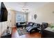 Cozy living room with hardwood floors, lots of natural light, and comfortable seating at 4002 San Gallo Dr # 106, Kissimmee, FL 34741