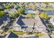 Exterior view of multi-colored townhome with well-kept landscaping and a private entrance with an arrow pointing to the front door at 4002 San Gallo Dr # 106, Kissimmee, FL 34741