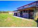 Large barn structure with stalls and storage featuring sturdy wooden construction and ample space at 41636 Outlaw Ln, Weirsdale, FL 32195