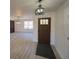 Welcoming entryway with a front door and views of the open living area at 41636 Outlaw Ln, Weirsdale, FL 32195