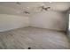 Open living room with ample space and sleek, modern flooring at 41636 Outlaw Ln, Weirsdale, FL 32195