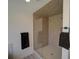 Modern bathroom features a stand-up tiled shower, glass door, and modern fixtures at 41636 Outlaw Ln, Weirsdale, FL 32195