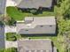 Aerial view of the house showing the roof, landscaping, driveway, and surrounding neighborhood at 439 Madera Pass, Poinciana, FL 34759