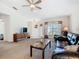 Inviting living room with plush leather seating, ample natural light, and neutral decor at 439 Madera Pass, Poinciana, FL 34759