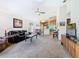 Open-concept living area with comfortable seating, connecting to the dining and kitchen spaces at 439 Madera Pass, Poinciana, FL 34759